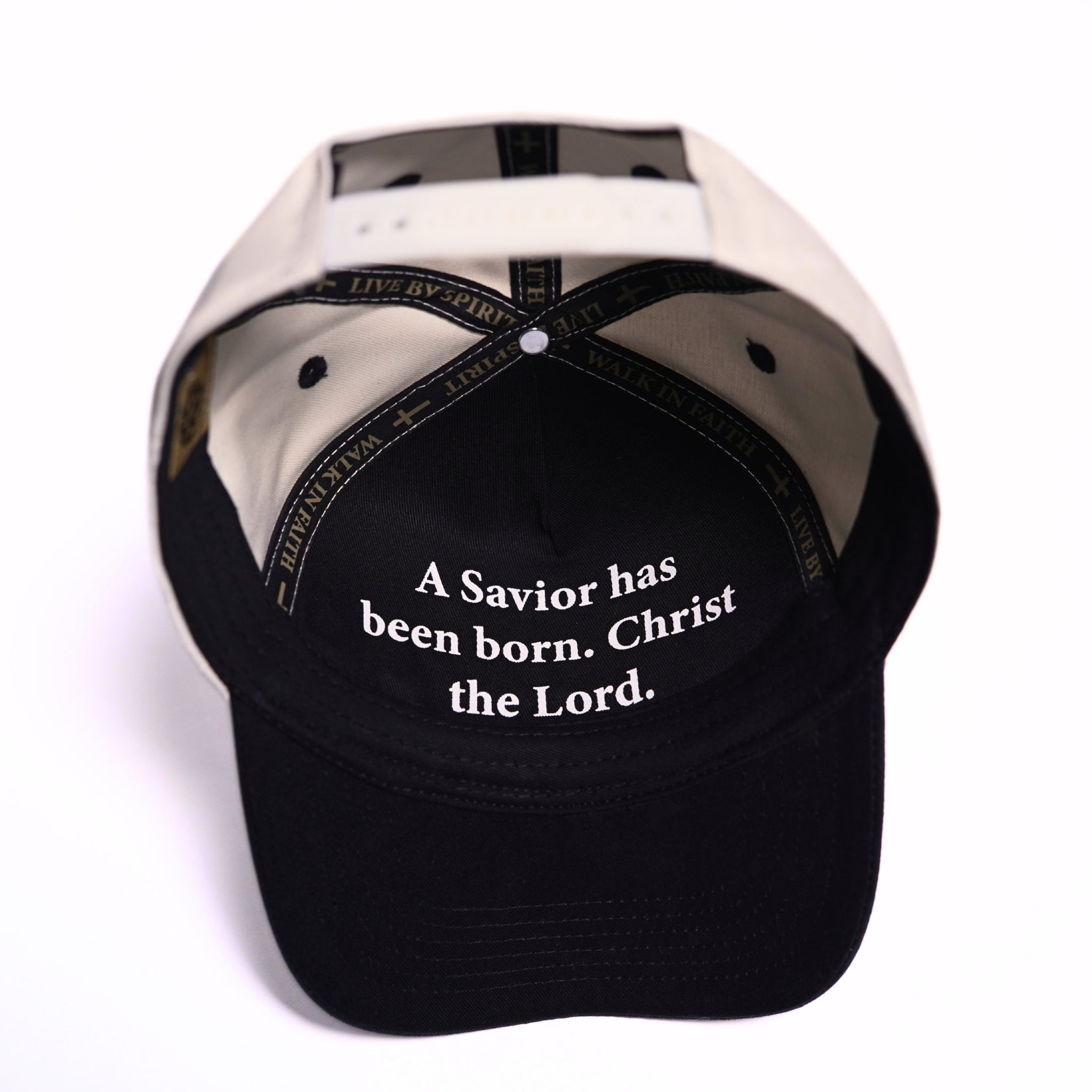 Luke 2:11 scripture hat by Born of Discipline featuring “a Savior has been born Christ the Lord” embroidered inside adjustable cap