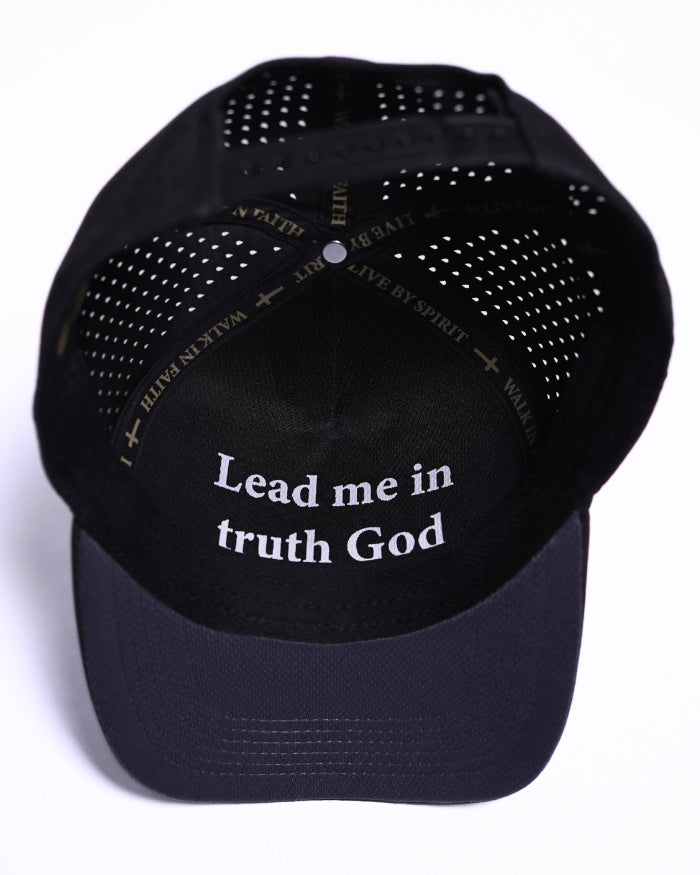 Black BHS performance cap with 'Lead me in truth God' text in the brim